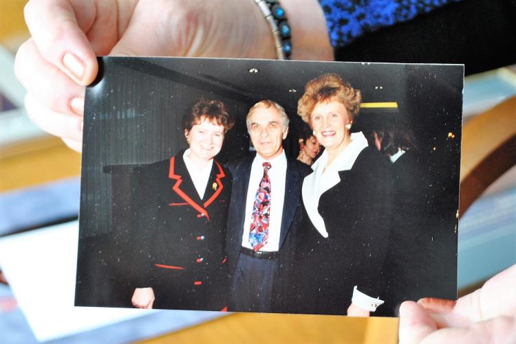 Mella (left), her husband Angelo and Catherine Callbeck as Premier / N. MacPhee Pat Mella holding a snapshot